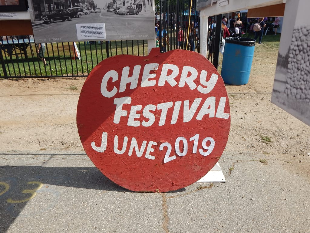 cherry festival apple sign